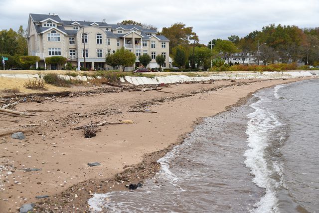 The shoreline of Tottenville, Staten Island, photographed in October 2021, is protected by a barrier of burst sandbags.